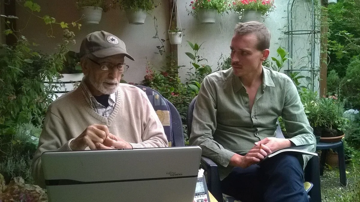In conversation with El Arbi Bouqdib in August 2015: two men sitting with a laptop in a garden